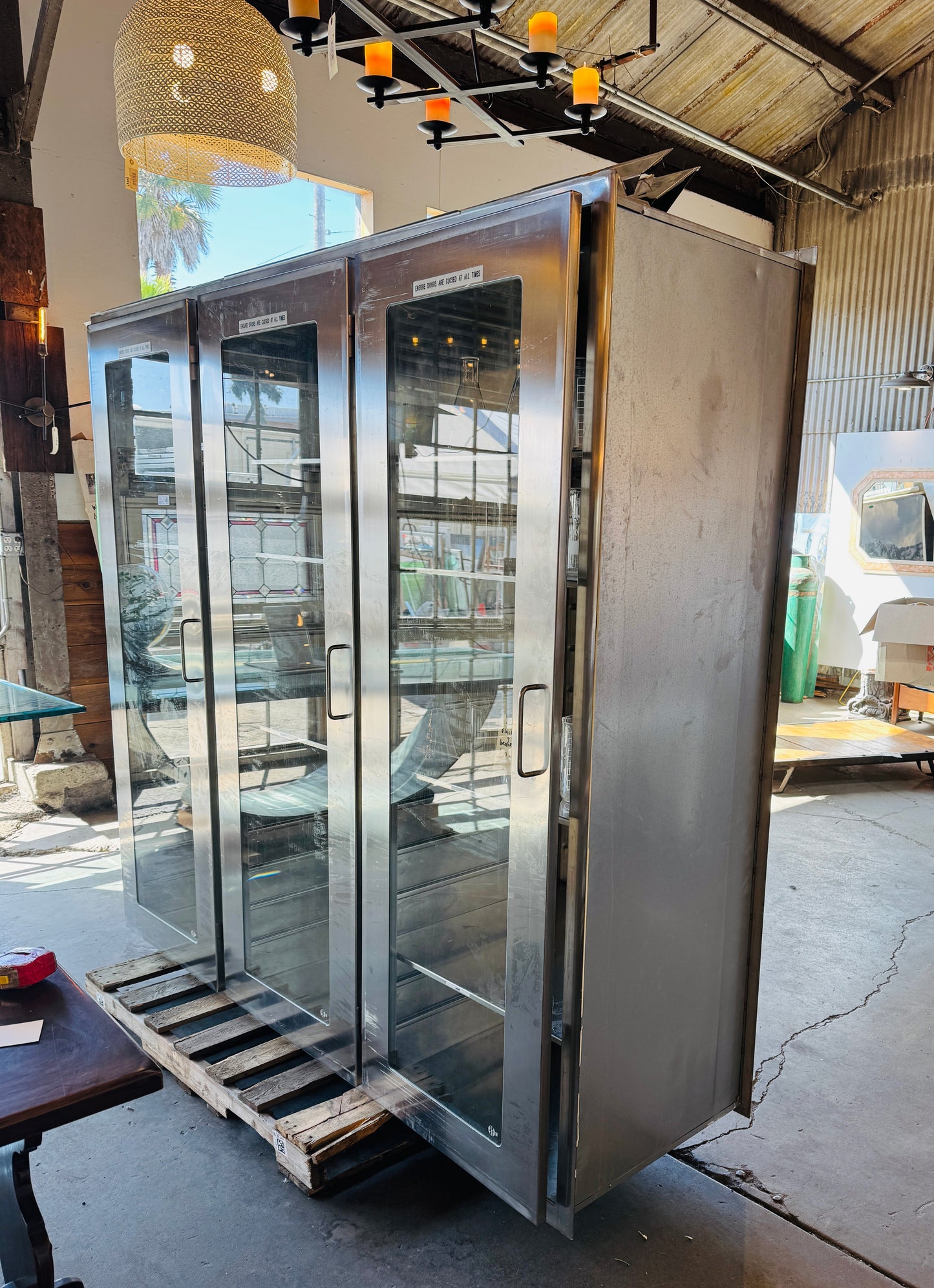 Reclaimed Stainless Steel And Glass Pass-Through Cabinets